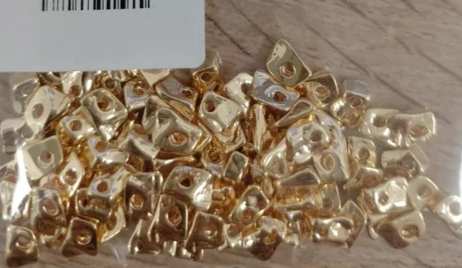 Бусина разд. Пласт.мят. 0,5х0,6мм зол. уп100шт
